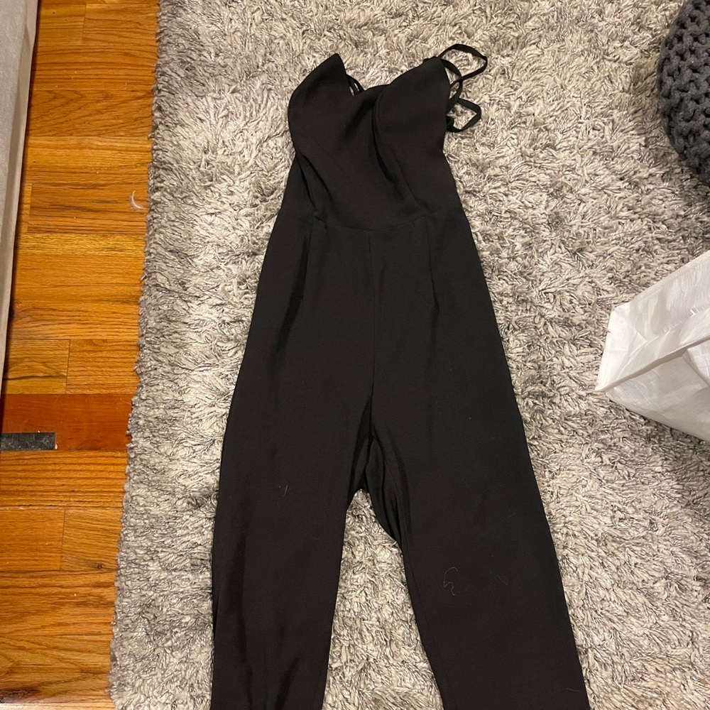 Lovely jumpsuit fits as a true small.